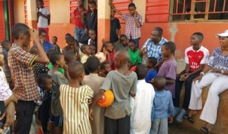 Lamin mentoring kids in an orphanage